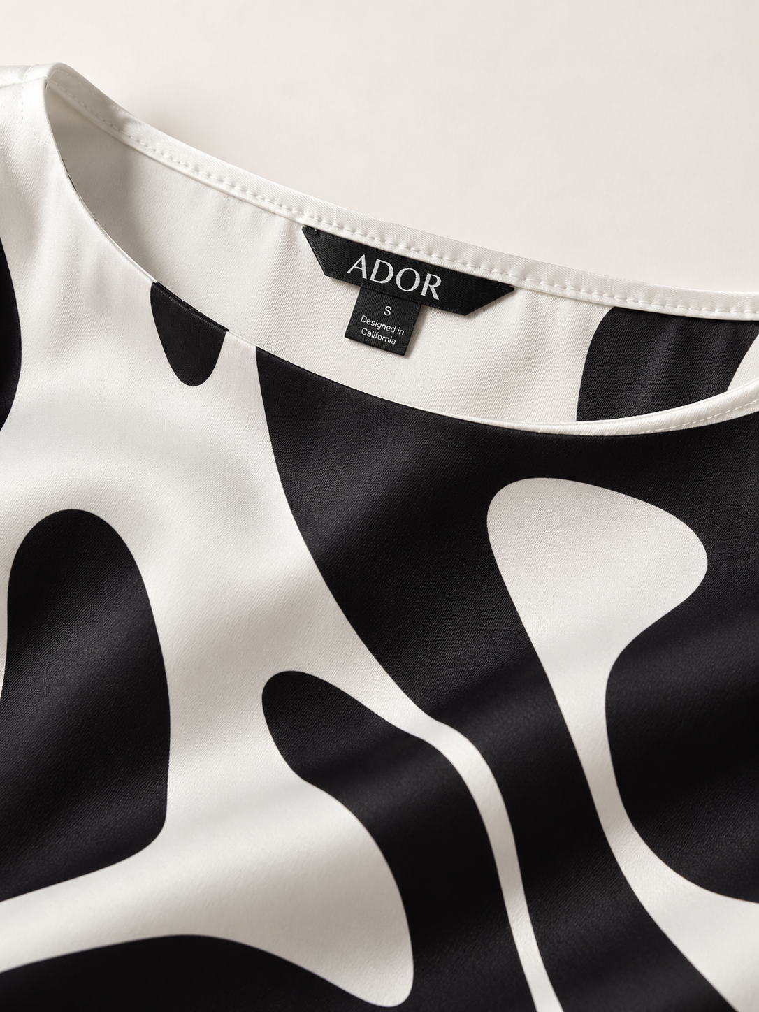 ADOR brand label detail on Artistic Graphic Print Silky Satin Graphic Shirt
