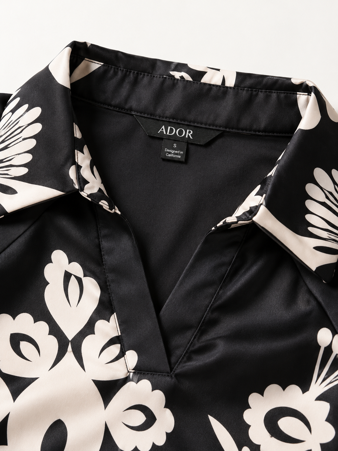 ADOR brand label detail on Satin Ethnic Print Raglan Modern Lapel Black Print Top