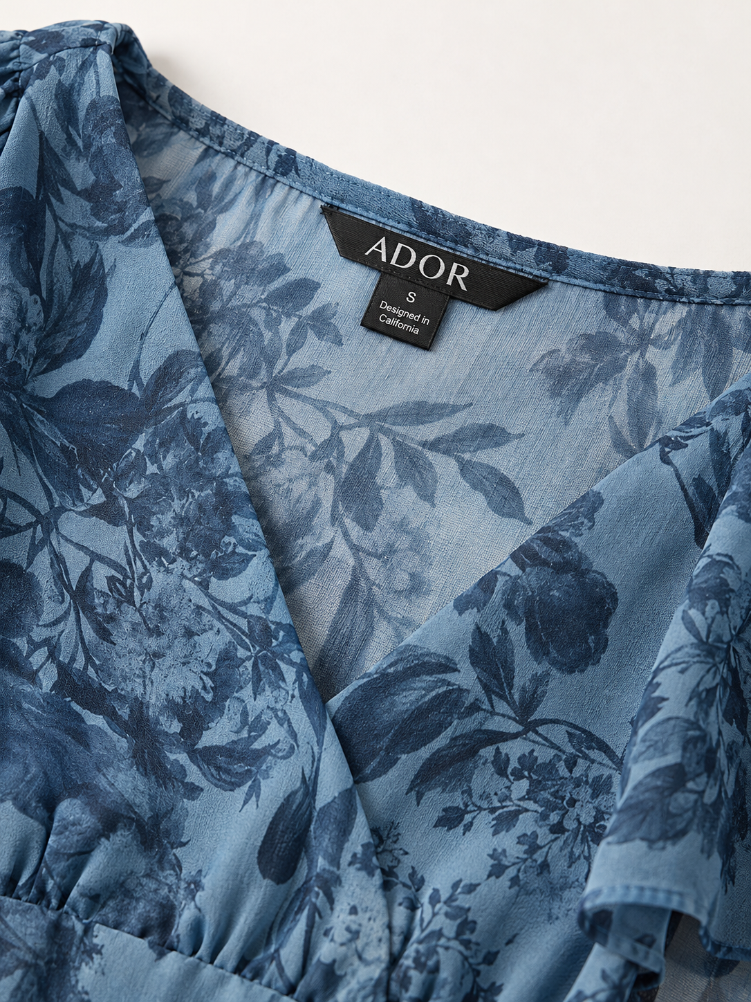 ADOR brand label detail on Floral Bloom Flowy Chiffon Tiered Maxi Dress