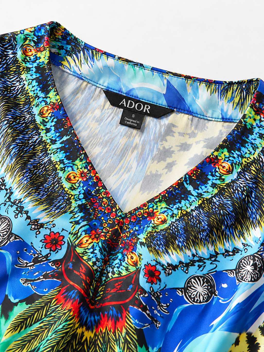 ADOR brand label detail on Jungle Wild Party Silky Satin Leopard Batwing Top