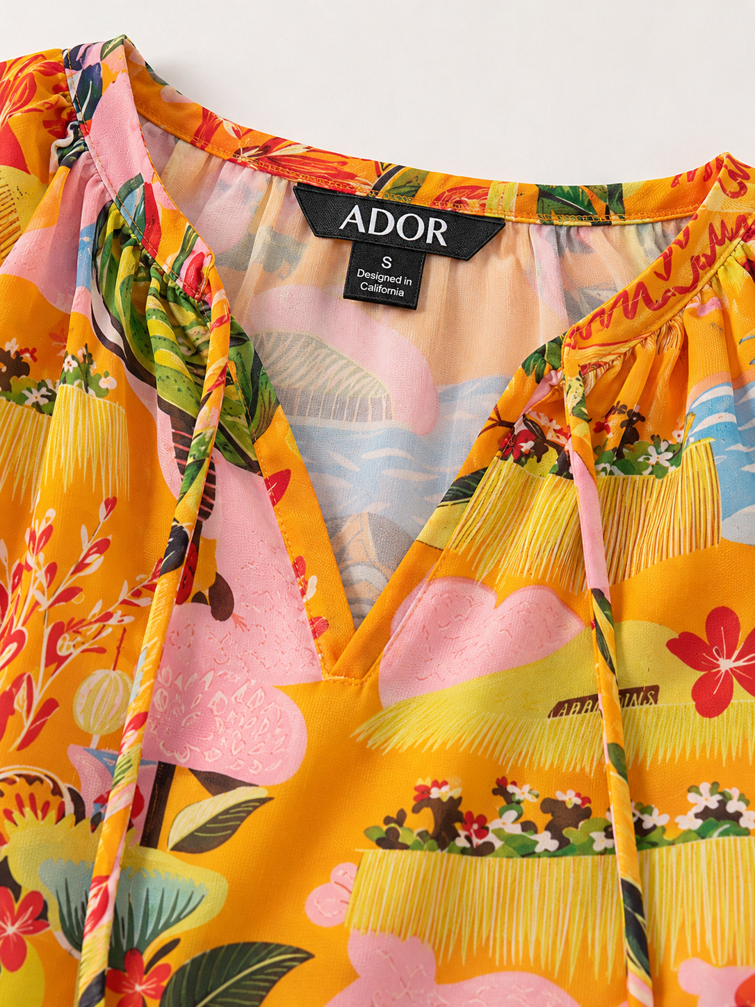 ADOR brand label detail on Summer Escape Flowy Chiffon Floral Blouse