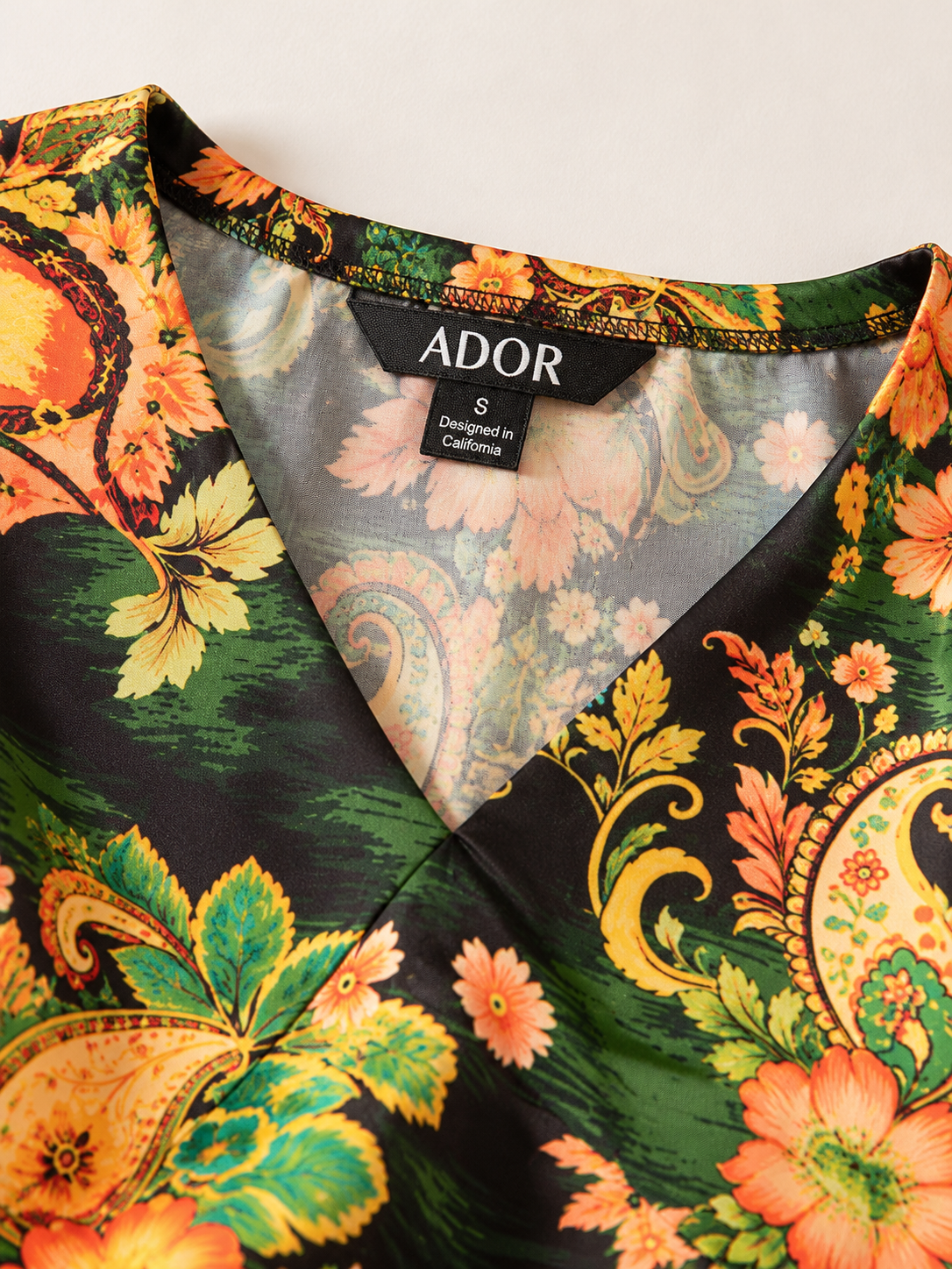 ADOR brand label detail on Paisley Bloom Silky Satin Dolman Sleeve Batwing Top