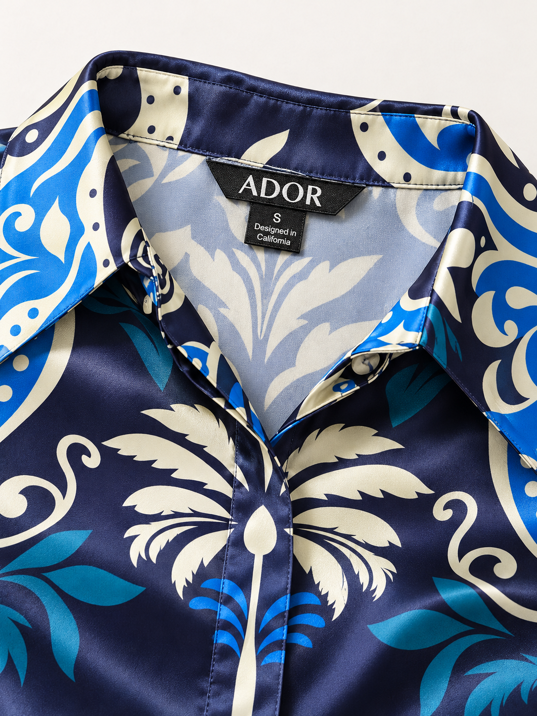 ADOR brand label detail on Azure Palace Harmony Silky Satin Button Down Oversized Shirt