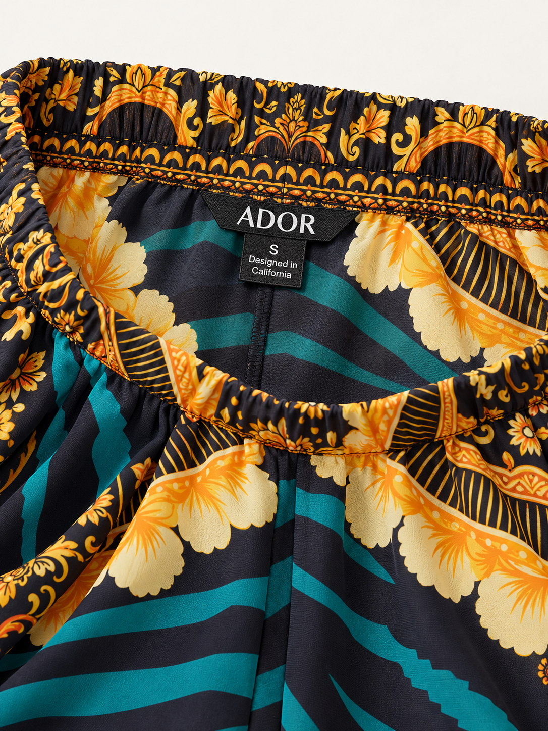 ADOR brand label detail on Emerald Empress Flowy Chiffon Wide Leg Pants