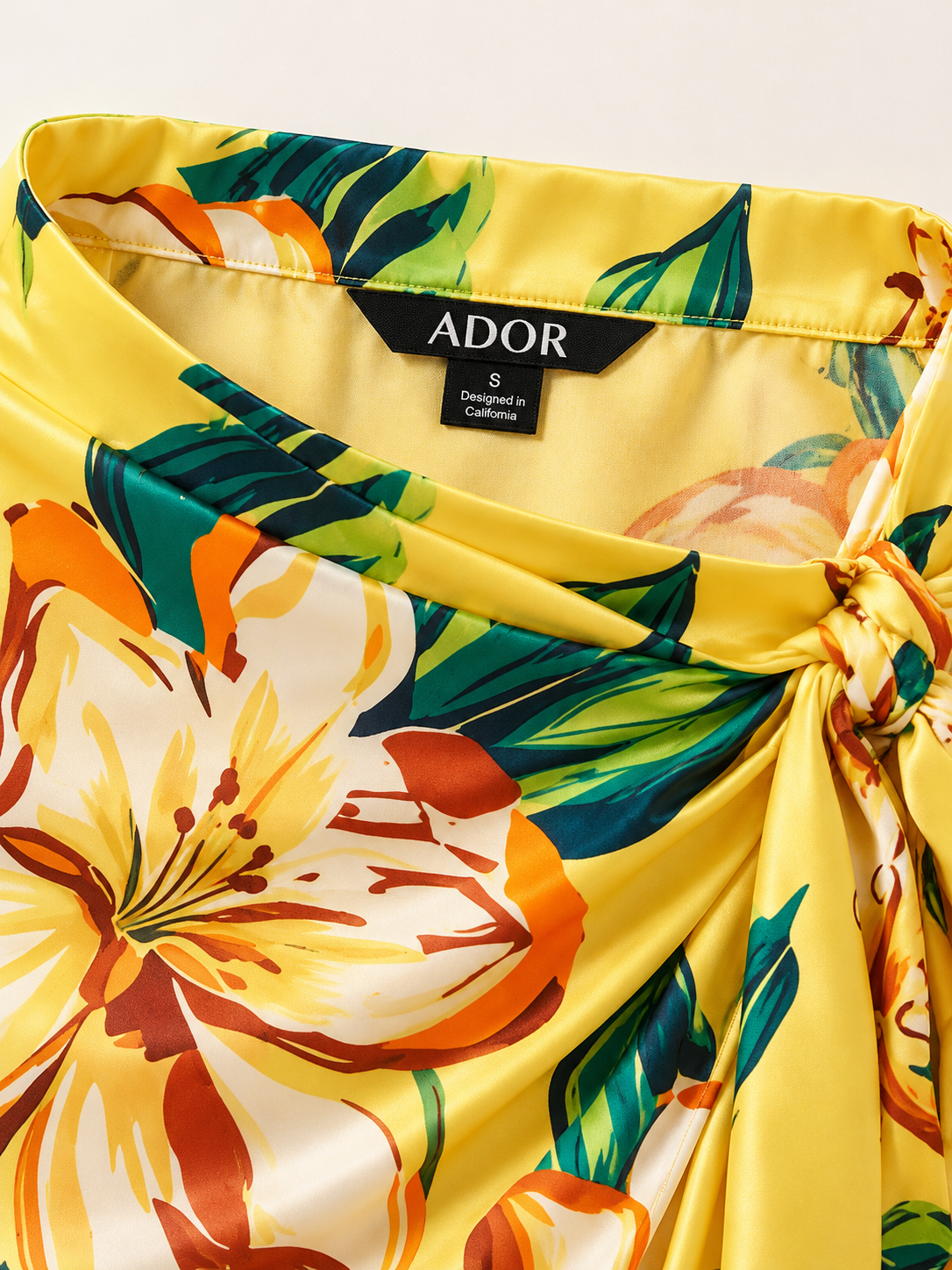 ADOR brand label detail on Lime Magnolia Glow Silky Satin Wrap Skirt