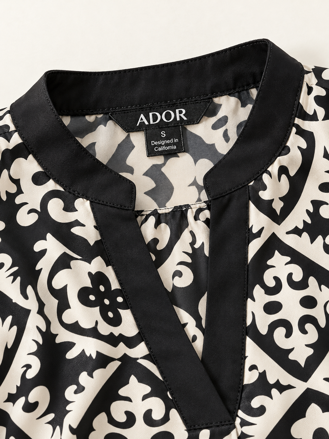 ADOR brand label detail on Satin Eden Moroccan Black and White Printed Blouse