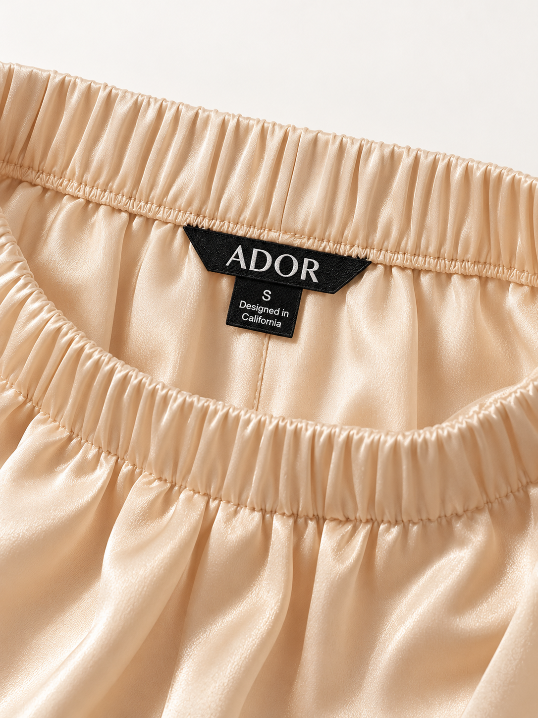 ADOR brand label detail on Silky Satin Apricot Elastic Waist Wide Leg Pants