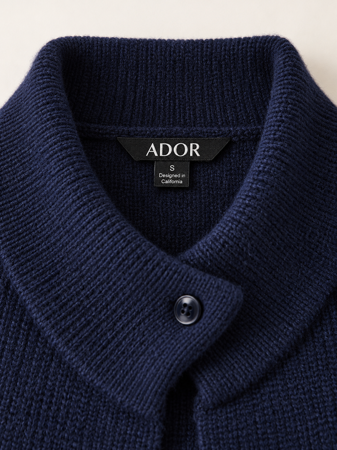ADOR brand label detail on Arctic Fleece Knit Turtleneck Cape