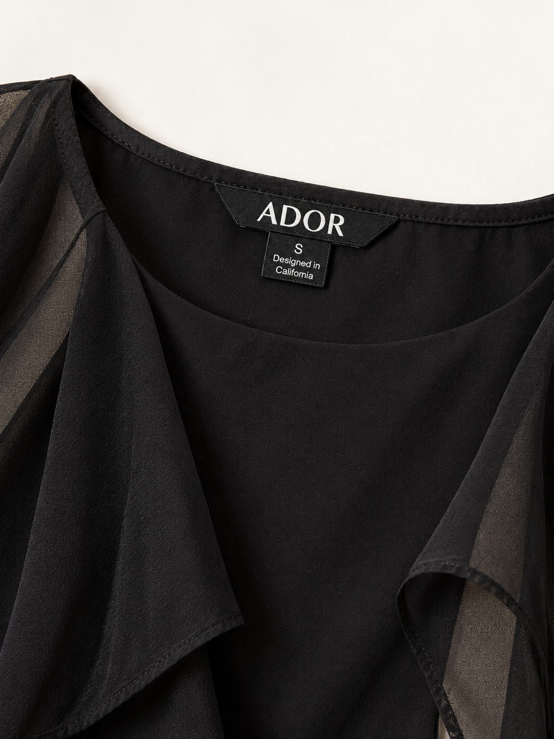 ADOR brand label detail on Chiffon Cape Sleeve Wedding Guest Mini Dress