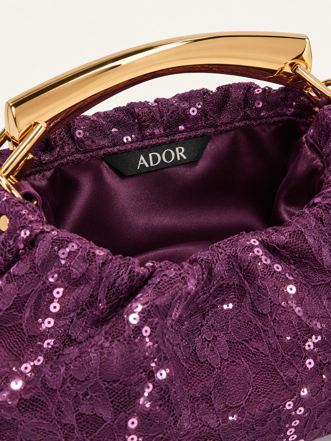 ADOR brand label detail on Jacquard Satin Sequin Frame Bag