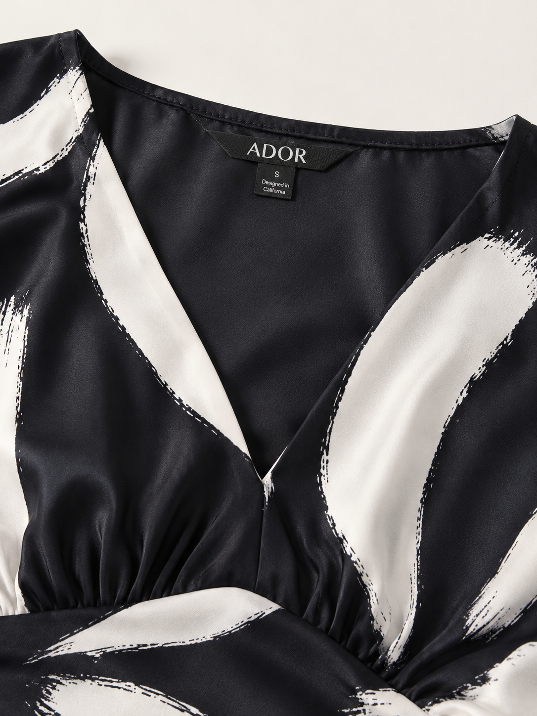 ADOR brand label detail on Abstract Floral Print Silky Satin Maxi Dress
