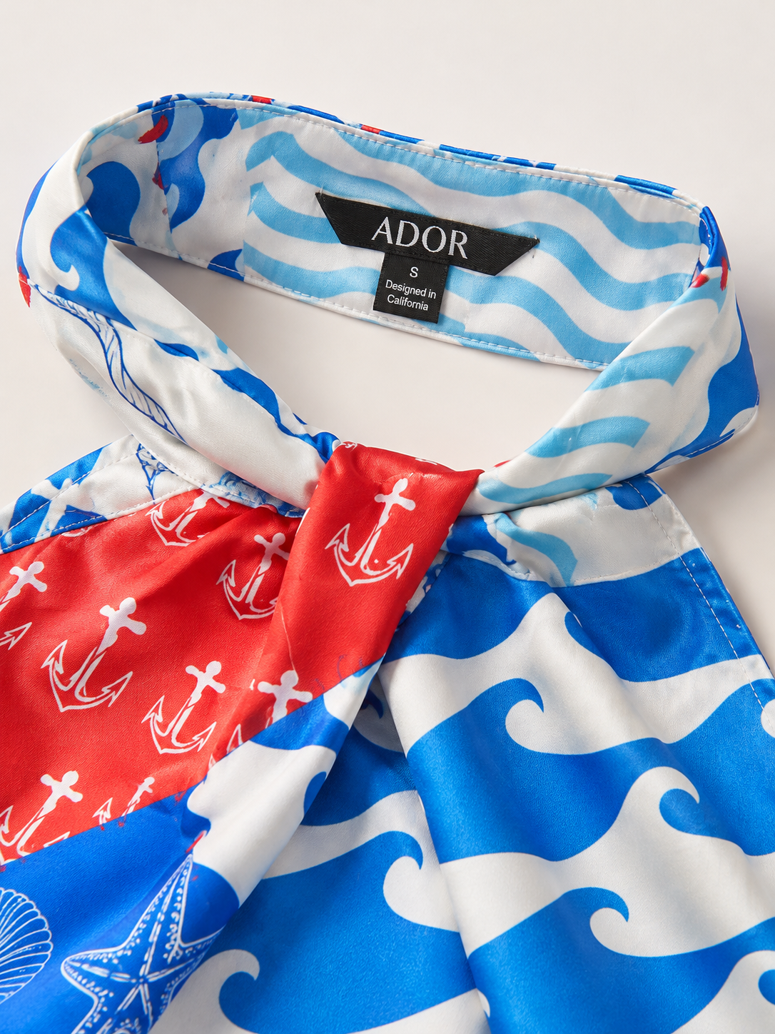 ADOR brand label detail on Satin Ocean-Inspired Geometric Print Set