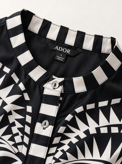 ADOR brand label detail on Noir Geometry Silky Satin Flare Cuff Blouse