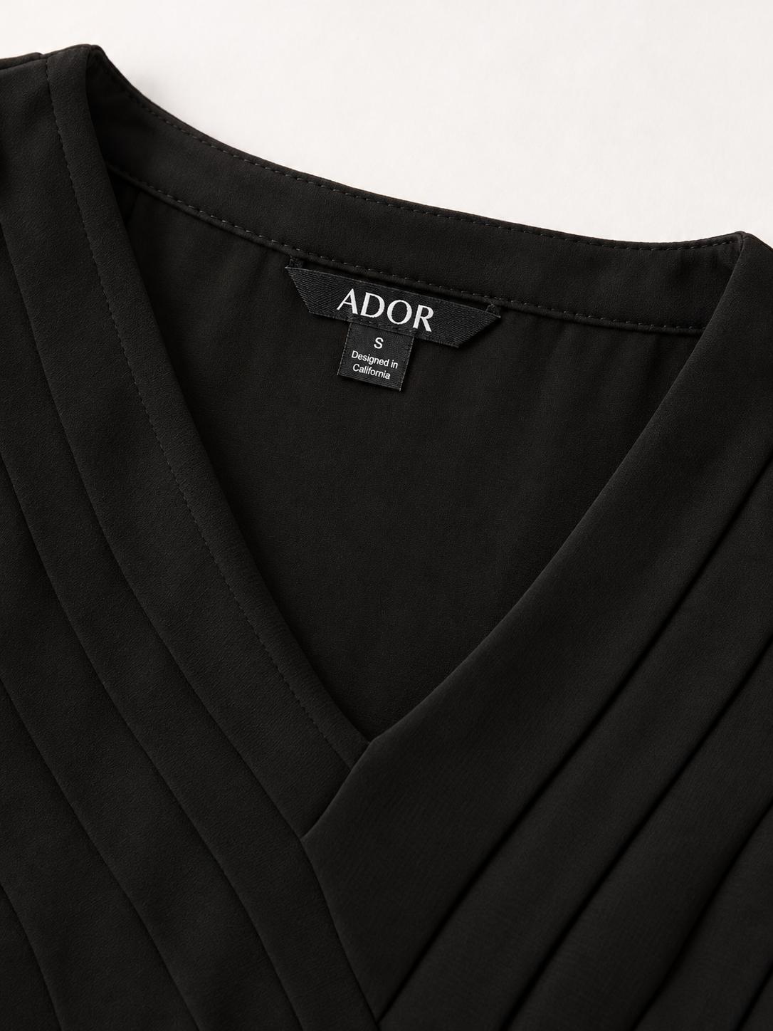 ADOR brand label detail on Paneled Design Faux Flowy Sheer Stretch Fabric Jumpsuit