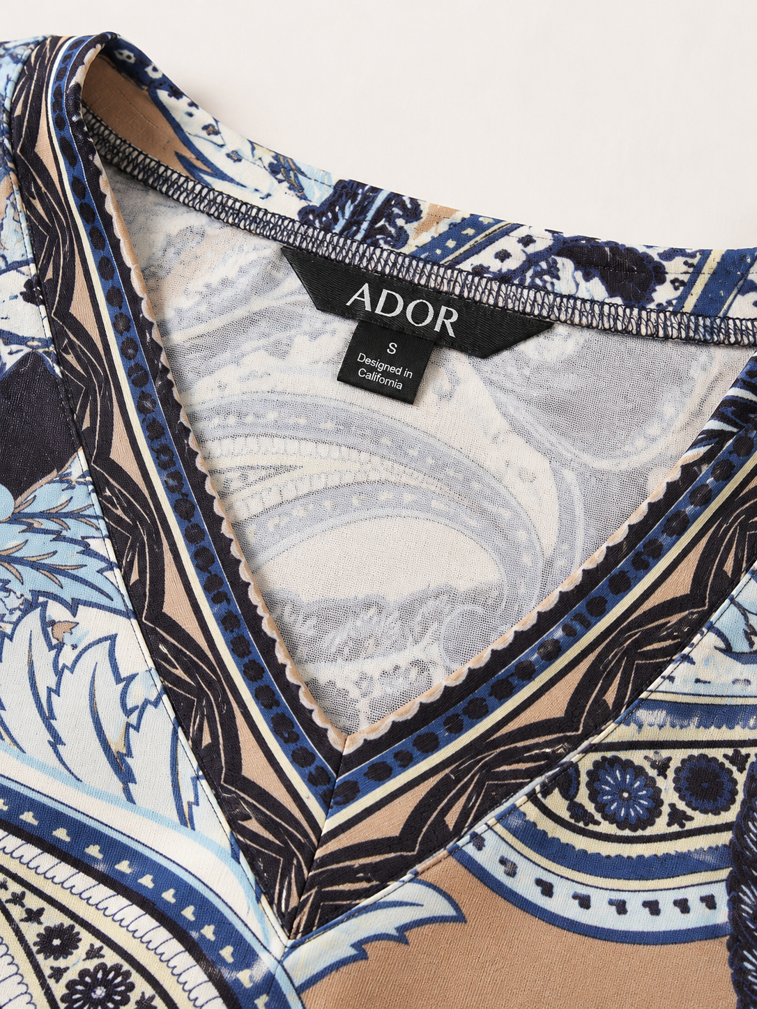 ADOR brand label detail on Abstract Paisley Print Knit Stretch Fitted Maxi Dress