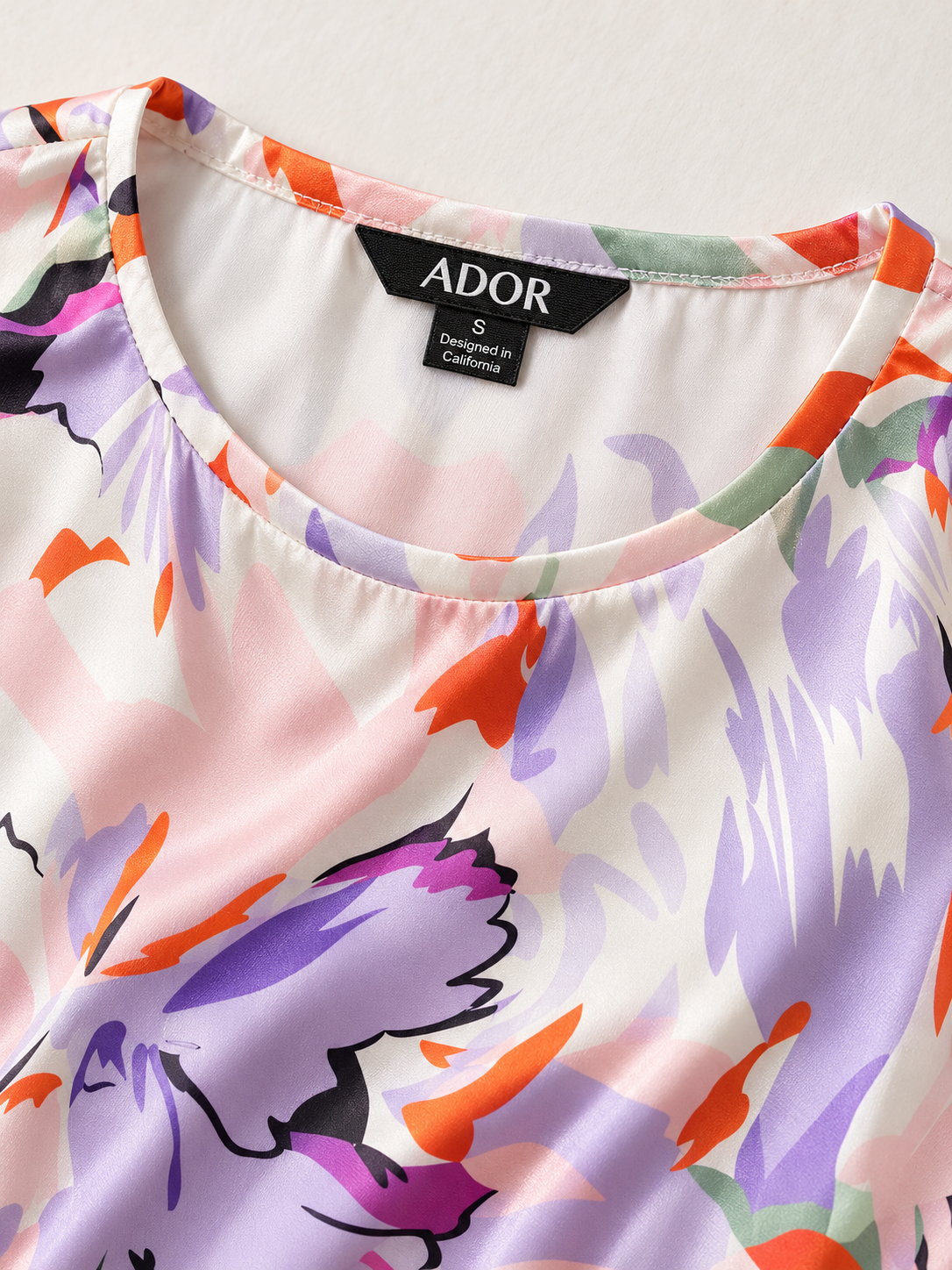 ADOR brand label detail on Spring Blooms Silky Ruched Pink Summer Maxi Dress