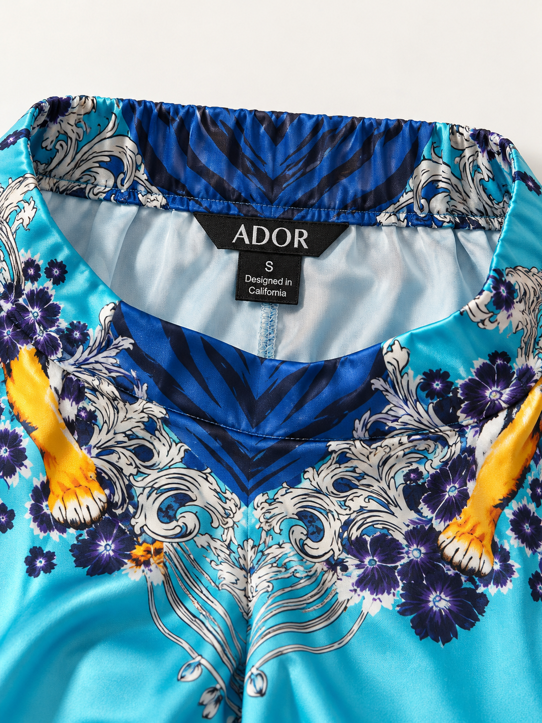 ADOR brand label detail on Indigo Tigress Silky Satin Vacation Pants