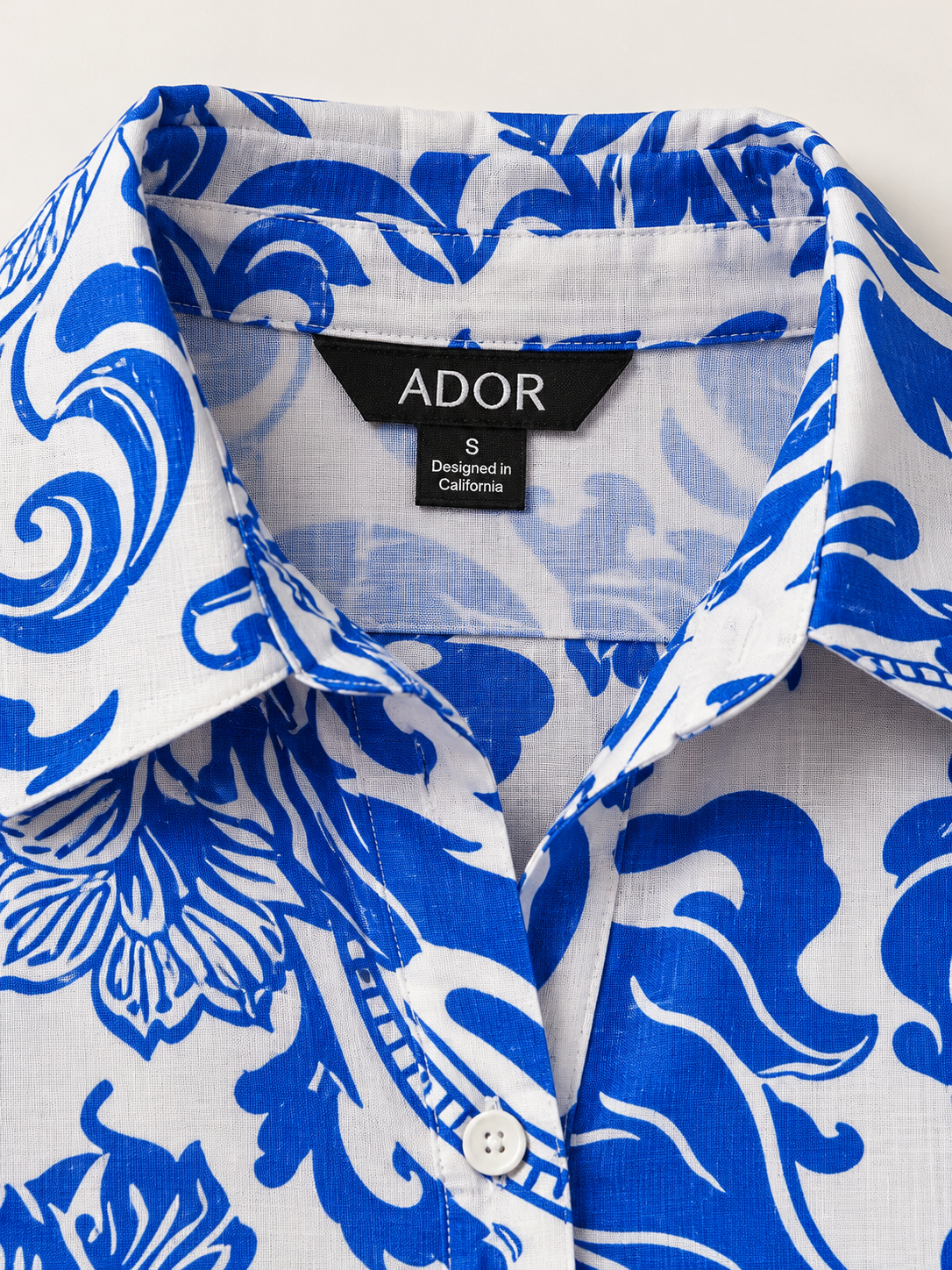 ADOR brand label detail on St Barth Blooms Effortless Linen-Style Shirt Dress