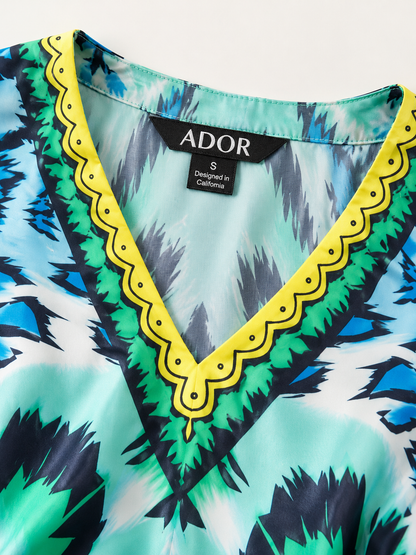 ADOR brand label detail on Land of Wonder Silky Satin Vacation Satin Batwing Top