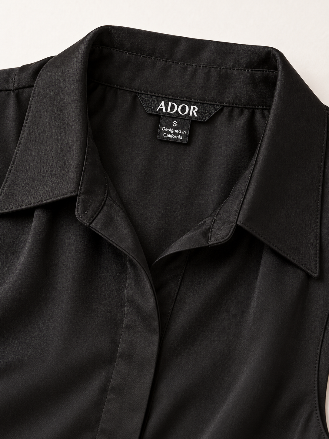 ADOR brand label detail on The Essential Series Silky Satin Sleeveless Top