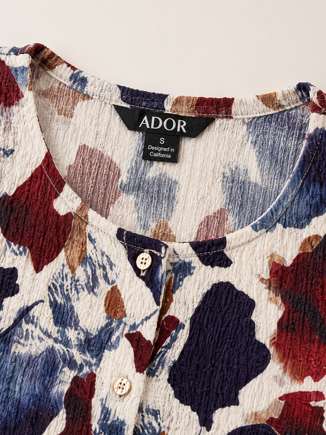 ADOR brand label detail on Floral Stretch Fabric Top