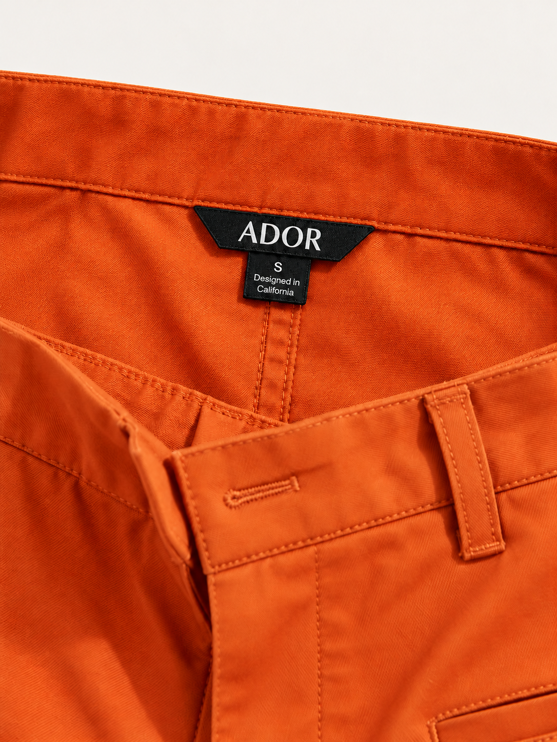 ADOR brand label detail on Fine Twill Cotton Cropped Tapered Pants