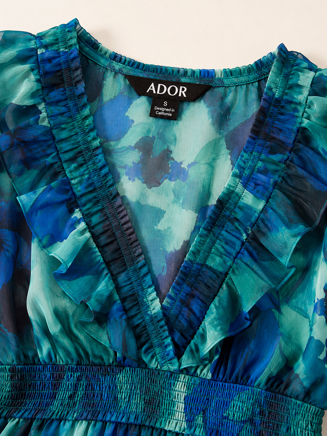 ADOR brand label detail on Ocean Bloom Reverie Flowy Chiffon Maxi Dress