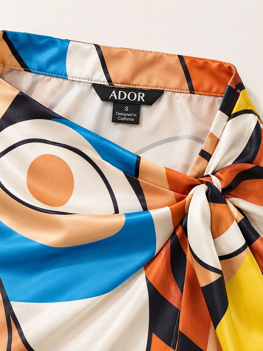 ADOR brand label detail on Abstract Art Silky Satin Wrap Skirt