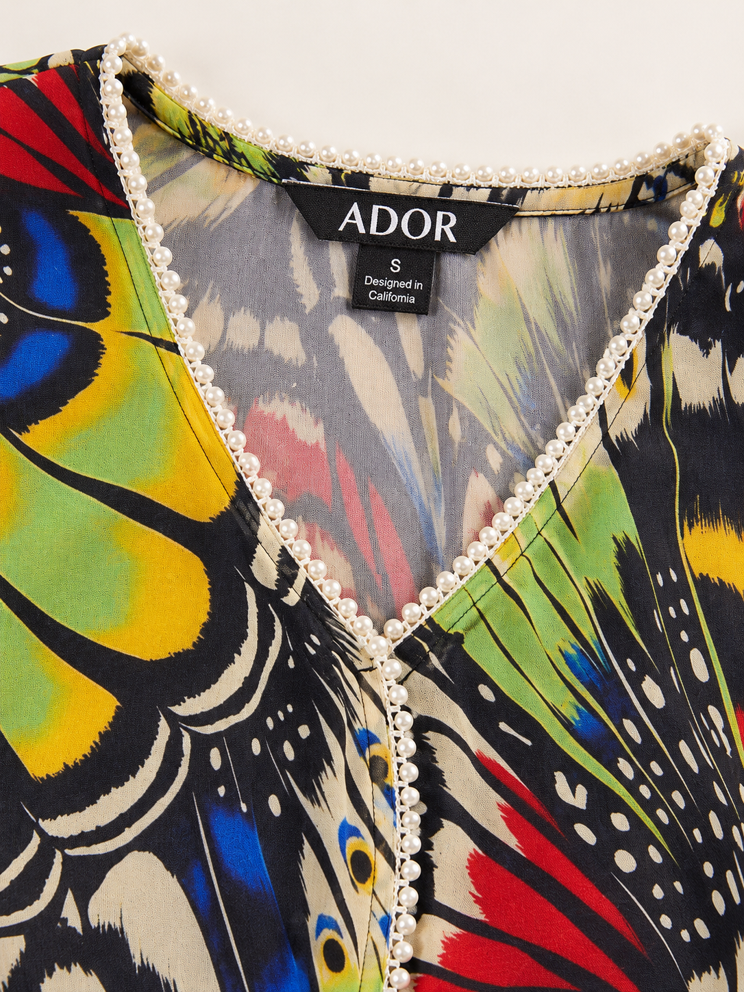 ADOR brand label detail on Jungle Butterfly Flowy Chiffon Midi Dress