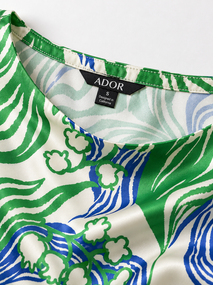 ADOR brand label detail on Abstract Bell Flower Silky Satin Batwing Top