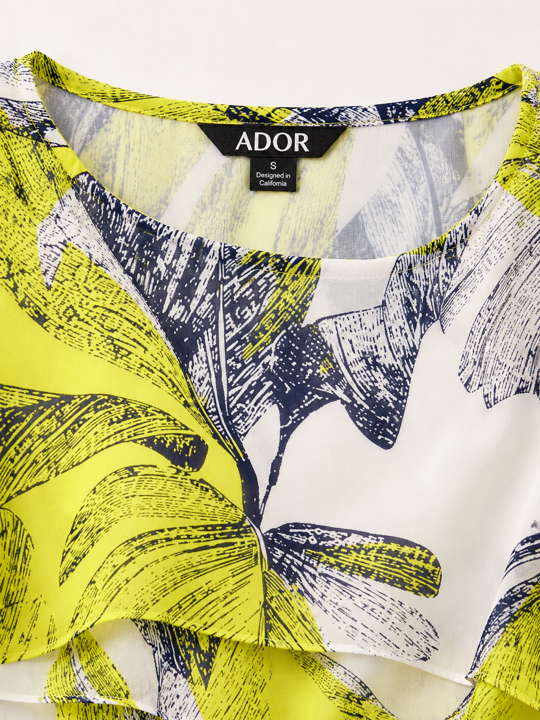 ADOR brand label detail on Citrus Palm Luxe Layered Chiffon Blouse