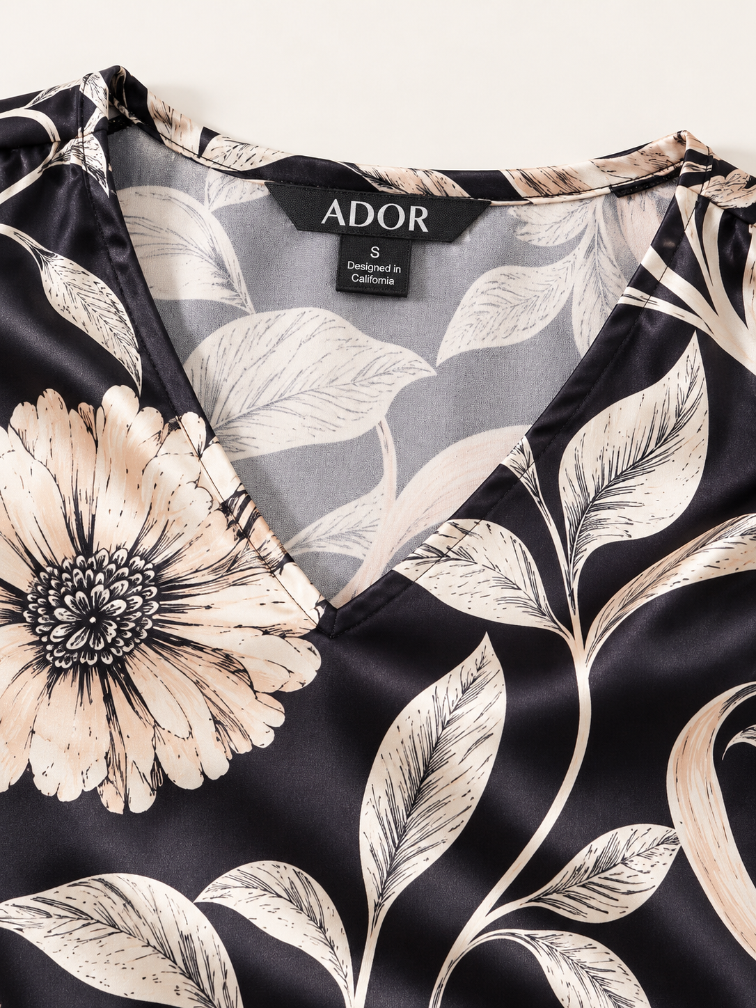 ADOR brand label detail on Golden Petal Silky Satin Blouse