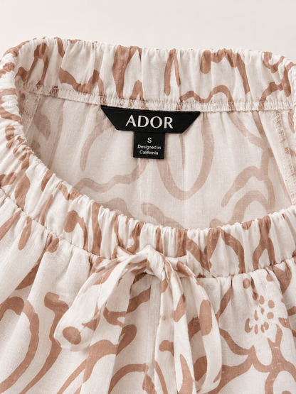 ADOR brand label detail on Artistic Print Elastic Linen-Like Wide-Leg Pants