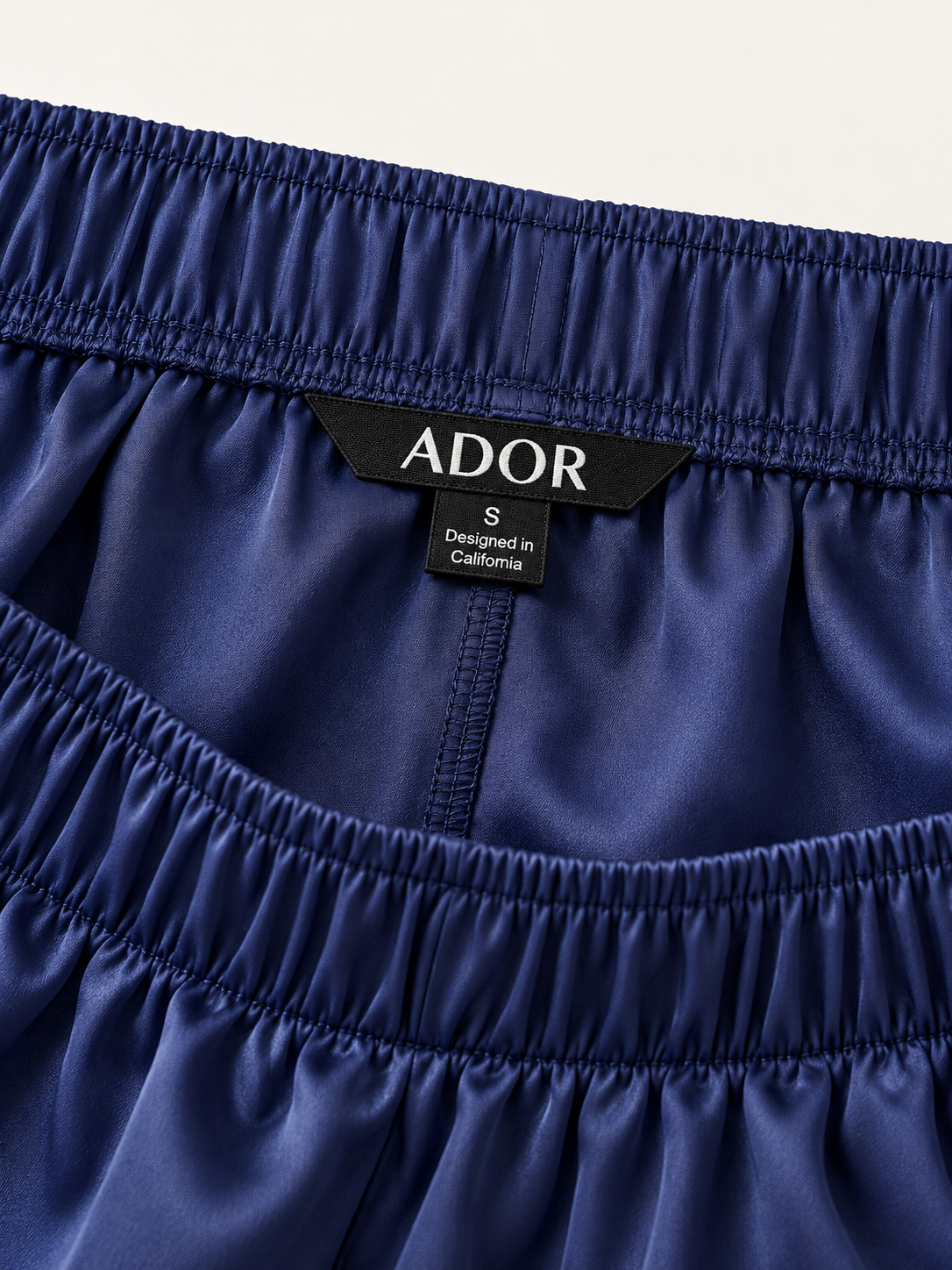ADOR brand label detail on Blue Watercolor Iris  Satin Wide Leg Pants
