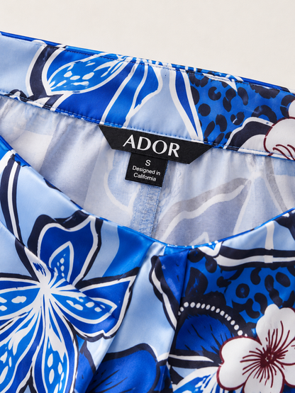 ADOR brand label detail on Azure Bloom Satin Slit Wide Leg Pants