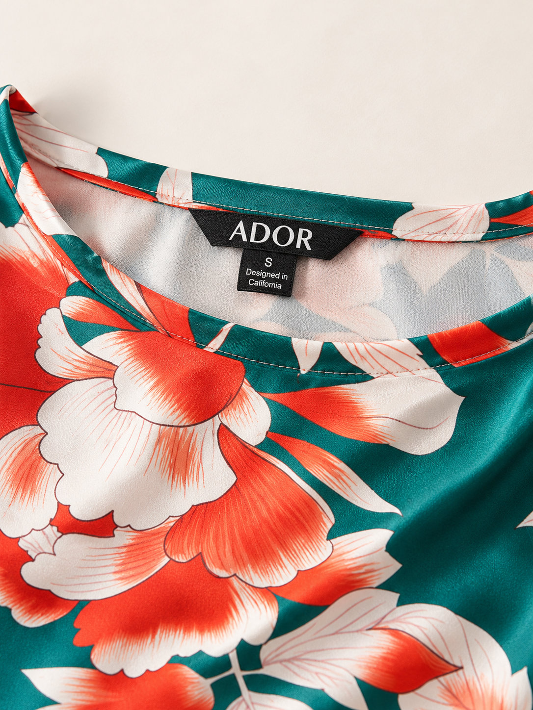 ADOR brand label detail on Deep Green Hibiscus Silky Satin batwing Top