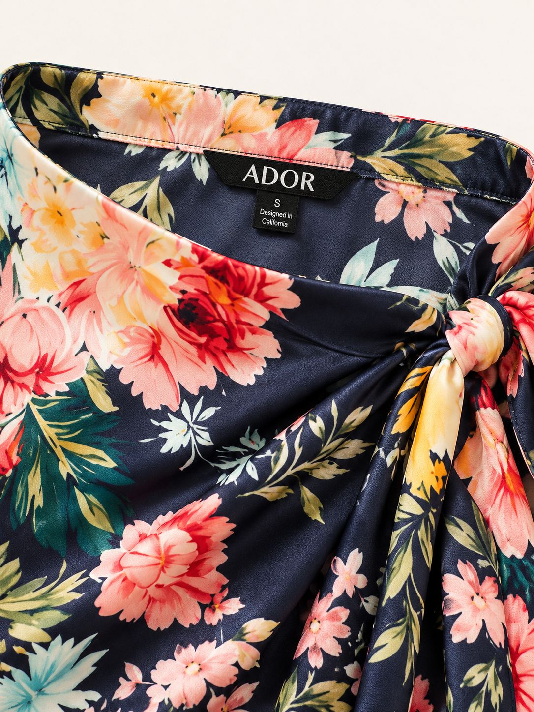 ADOR brand label detail on Moonlight Blossom Silky Satin Wrap Skirt