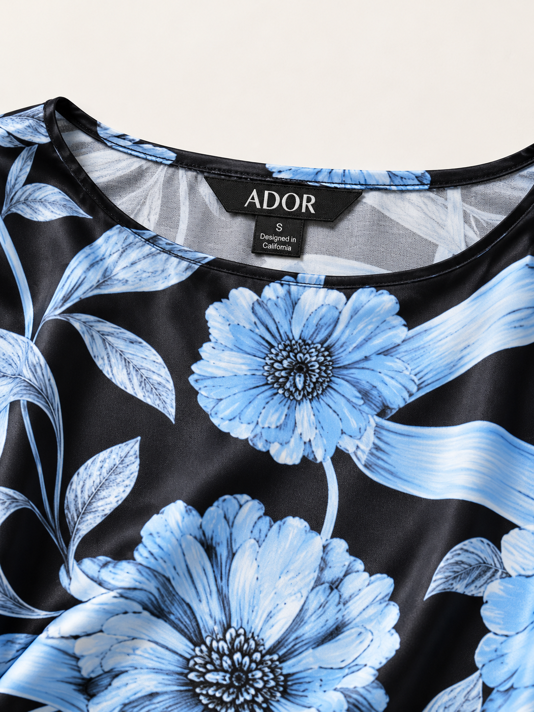 ADOR brand label detail on Glacier Blue Petal Silky Satin Dolman Sleeve Top