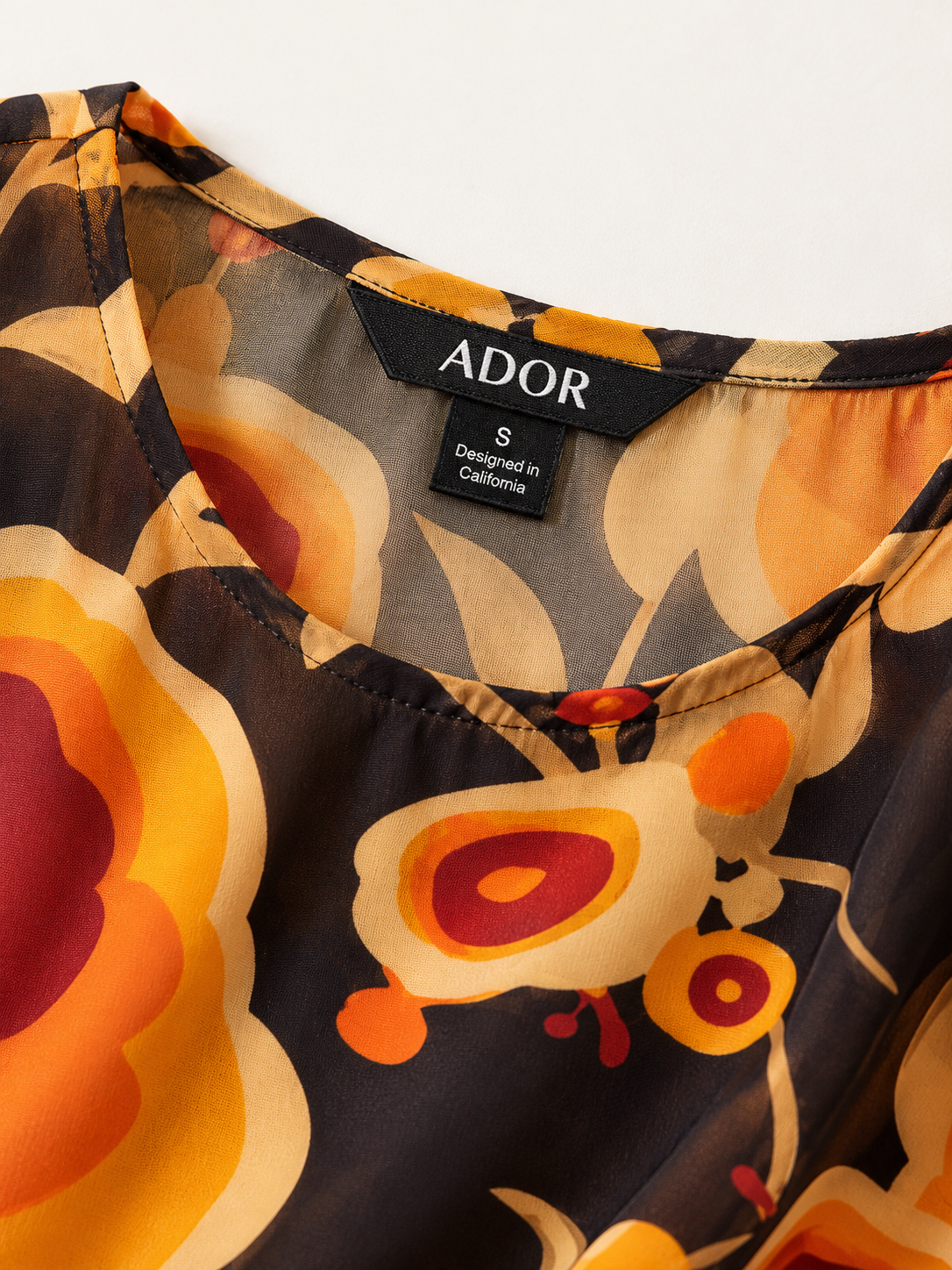 ADOR brand label detail on Sun Ember Layered Chiffon Blouse