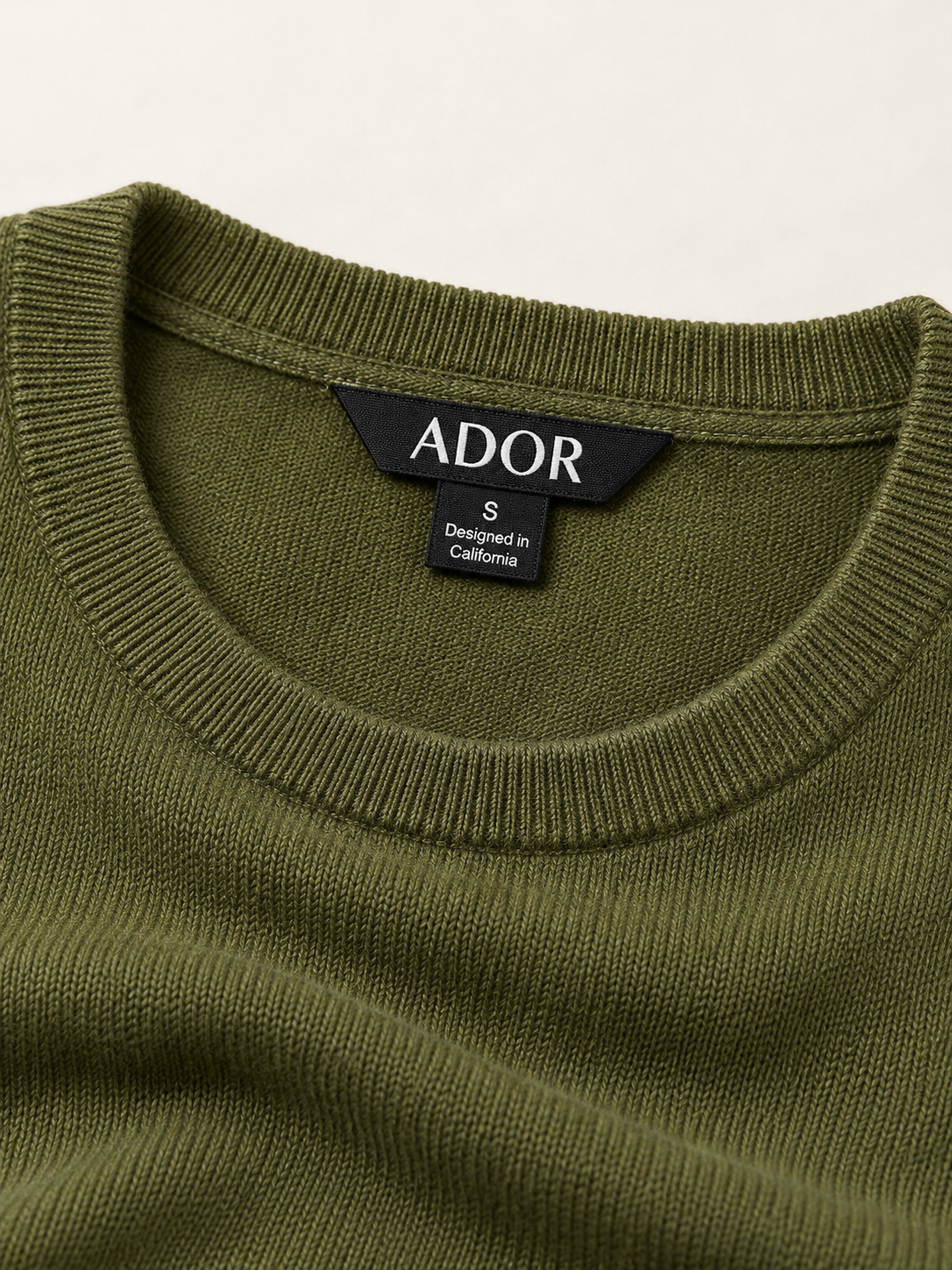 ADOR brand label detail on Modal Core Spun Yarn Crewneck Sweater
