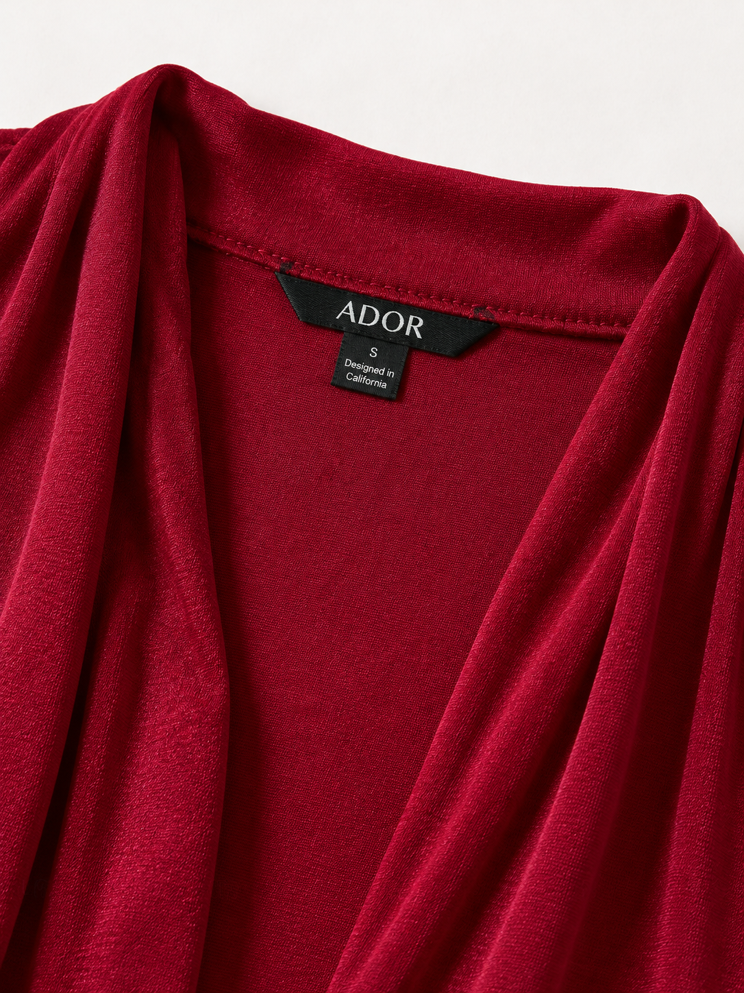 ADOR brand label detail on Acetate Look Stretch Knit Ruched Sleeve Jacket