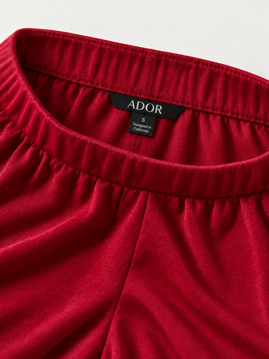 ADOR brand label detail on Acetate Look Stretch Straight Leg Pants